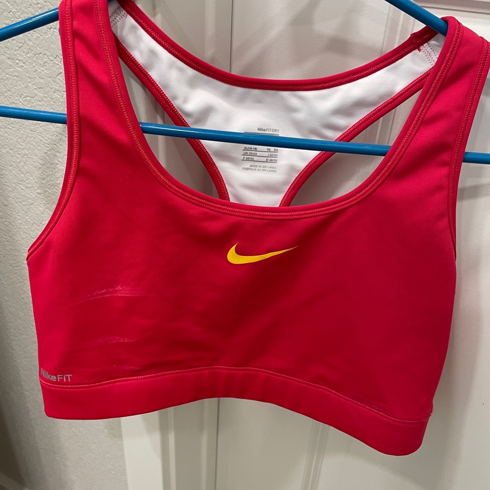 Nike Women's Bright Pink Sports Bra with Yellow Swoosh